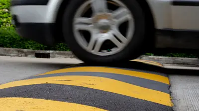 Car moving over speed bump