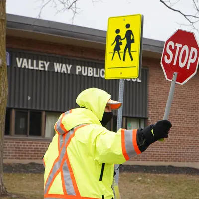 City of Niagara Falls crossing guard working at the crosswalk at Valley Way Public School