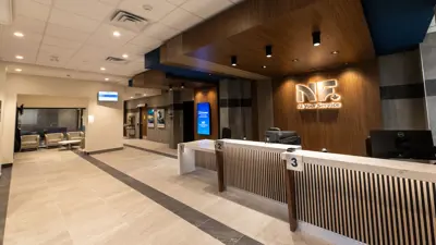Image of the At Your Service customer service counter at City Hall. Showing the counter and the lobby area in the left background.